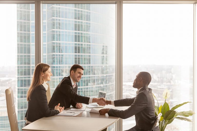 Employer shaking hands with employee