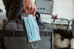 Business person carrying mask